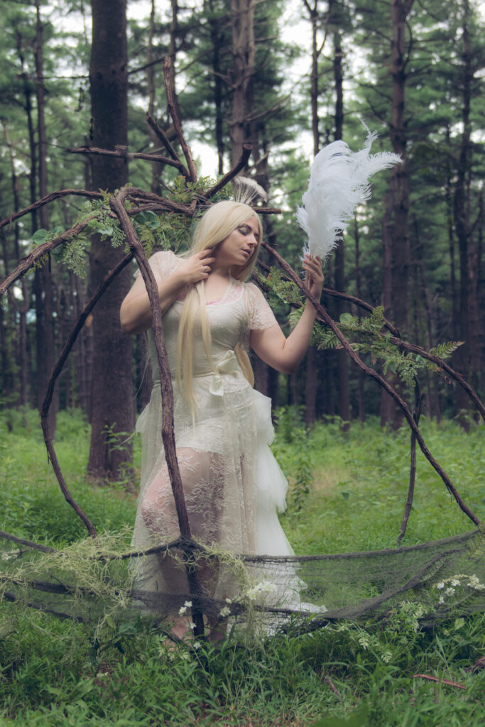 Fine art photography fantasy styled peacock in a cage