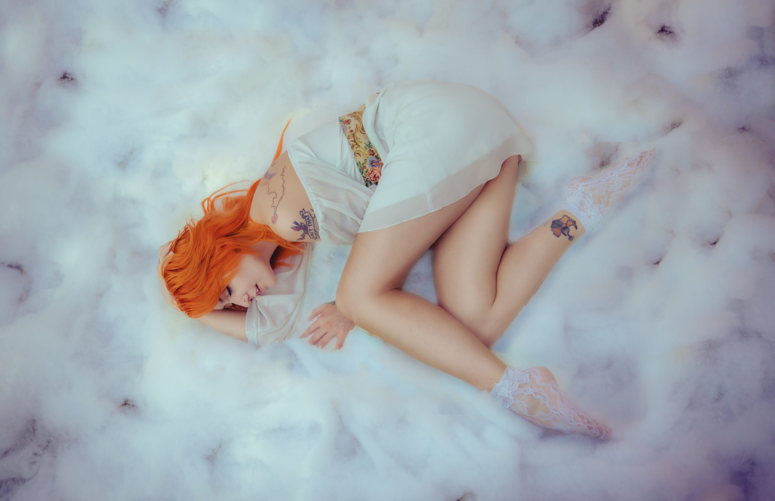 Fine art portrait, dreaming in clouds