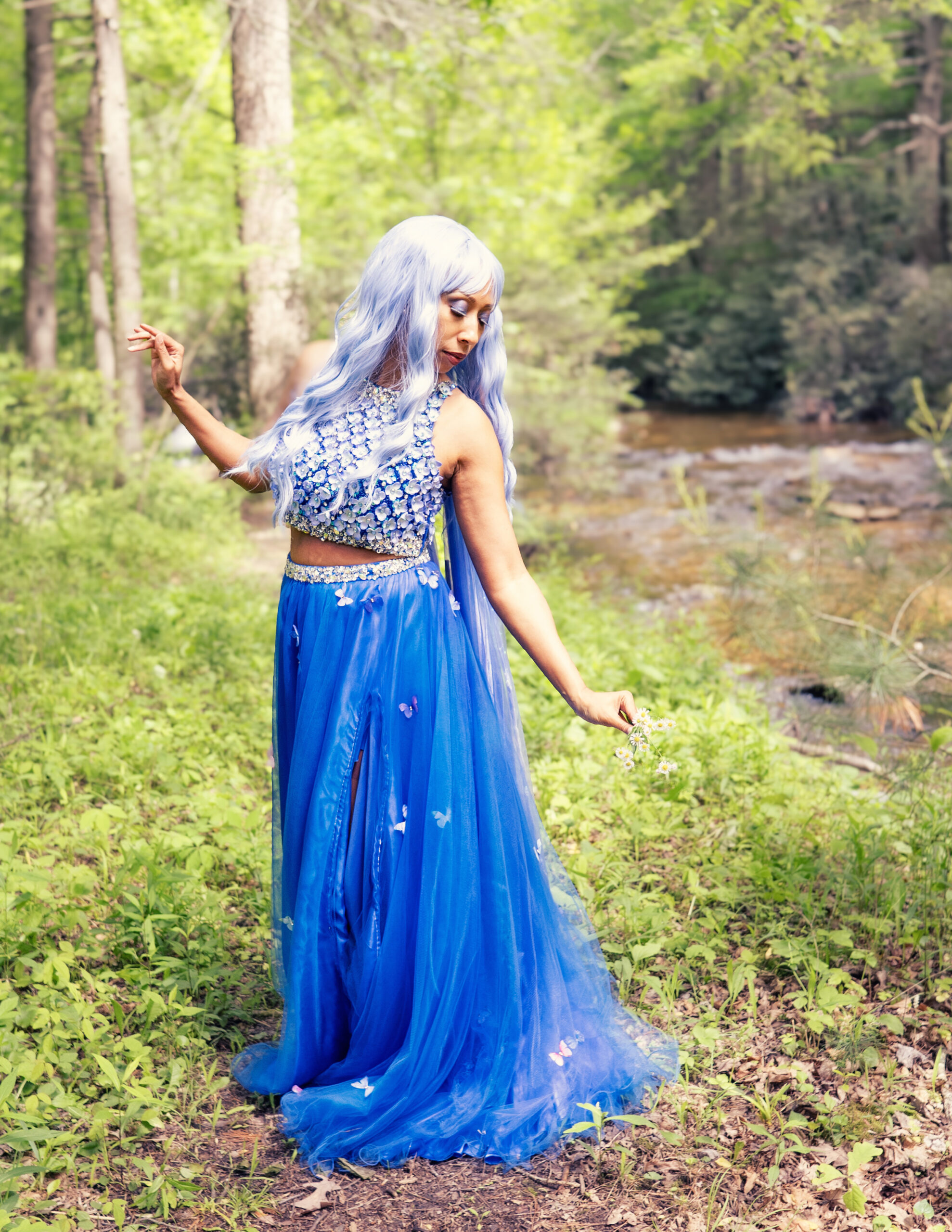 Fine art portrait of fairy along stream